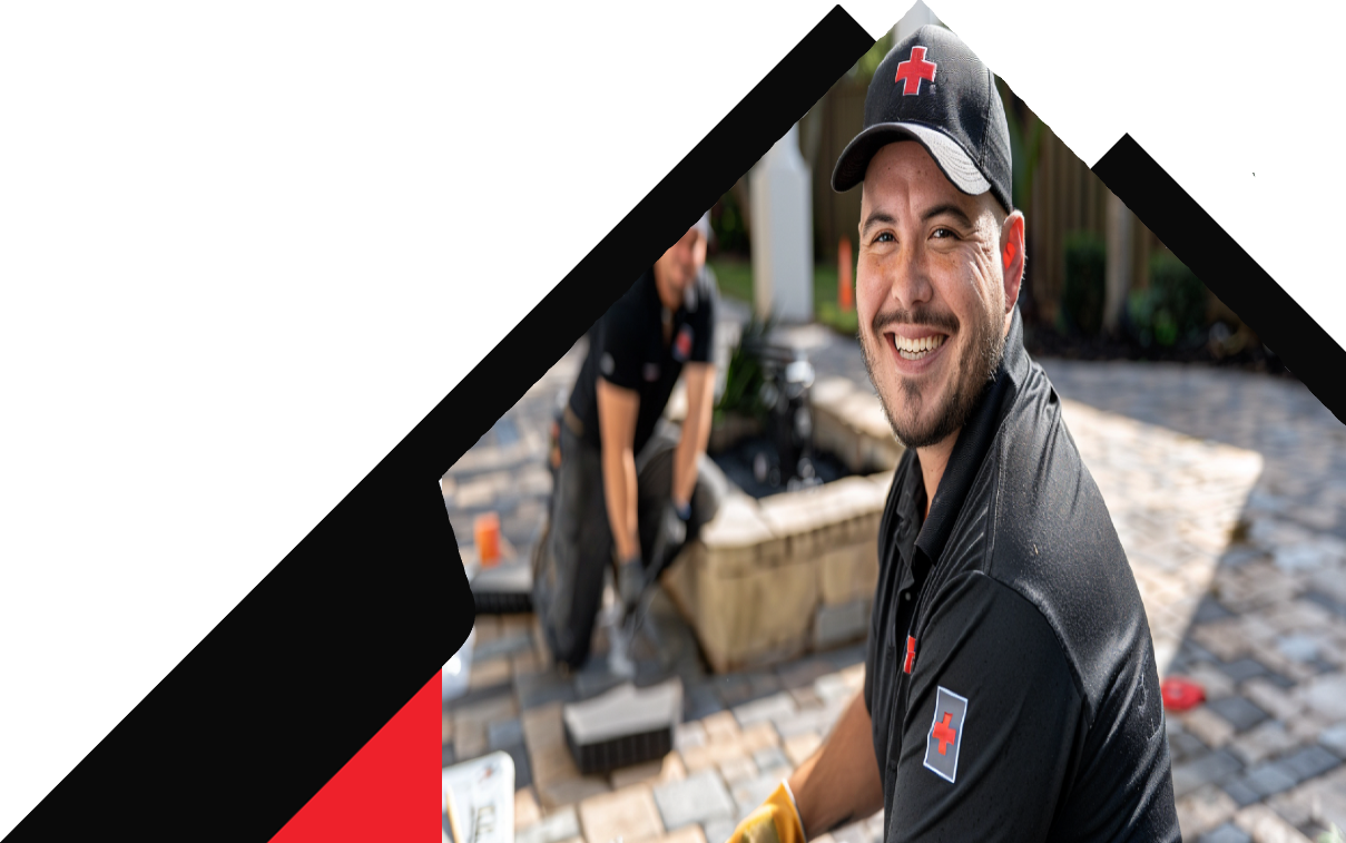 Smiling Floor Doctors technician on a paver project